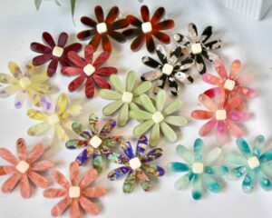 Assorted brightly-colored flower-shaped jewelry